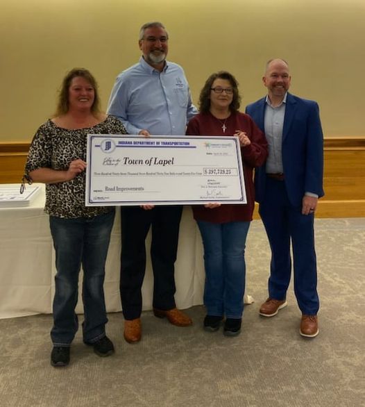 Governor Holcomb, Commissioner Smith of INDOT with Town President and Deputy Clerk Treasurer